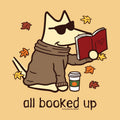 A stylized cartoon dog wearing sunglasses and a brown sweater sits reading a red book, with autumn leaves around it and the text 'all booked up' below. The image appears to be a graphic print design rather than a photographed physical product.