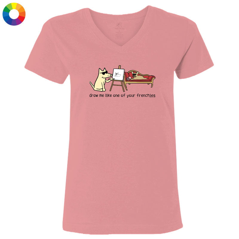 Pink t-shirt with a cartoon design of a cat drawing a dog, on a white background.