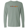 A sage green long-sleeve t-shirt with a horizontal line of small autumn-themed icons printed across the chest, including a paw print, maple leaf, dog, pumpkin, and sunflower.