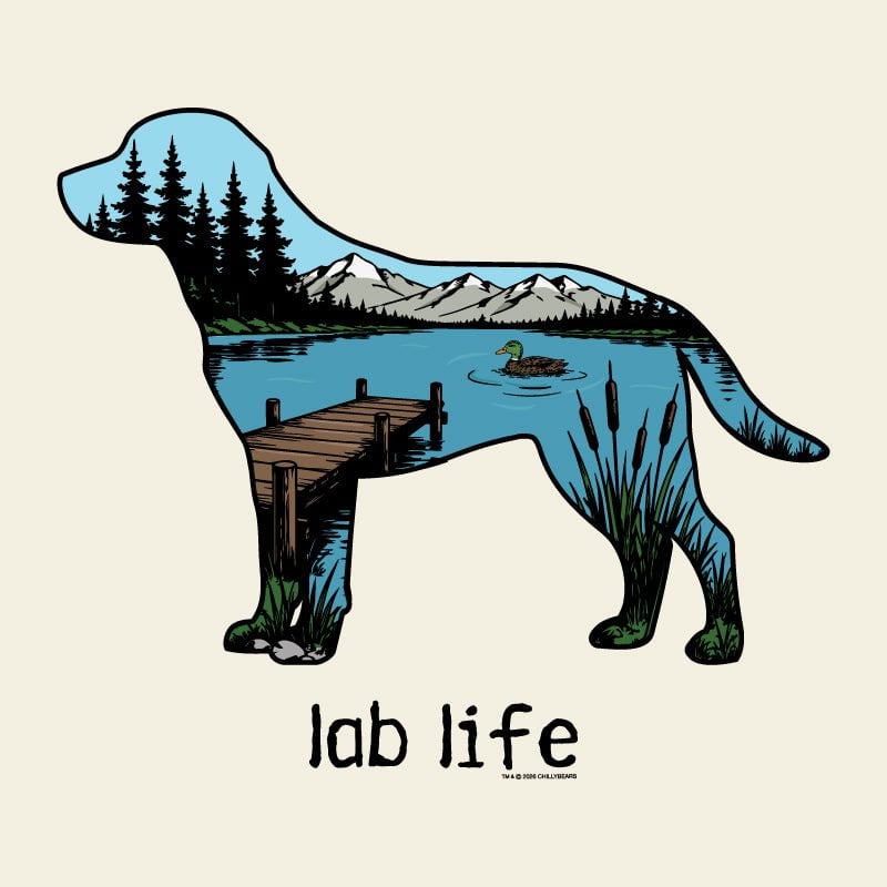 A stylized dog silhouette filled with a lakeside landscape scene, including mountains, pine trees, a dock, reeds, and a duck, above the text 'lab life' on a light cream background.