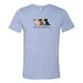 A light blue heather crewneck t-shirt featuring a graphic of three cartoon dogs in white, brown, and black, with the text 'uncoated, toasted, burnt.' printed below them.