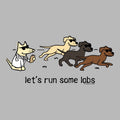 A cartoon graphic on a light gray background showing four dogs running from left to right, each wearing sunglasses. One dog on the left is a cat dressed as a lab coat, while the others are dogs.