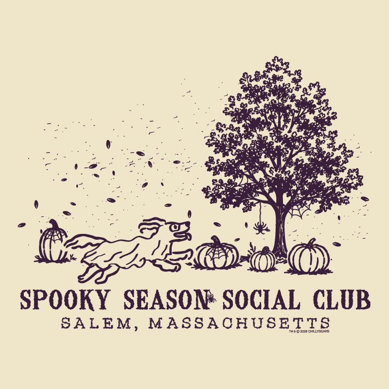 A vintage-style illustrated graphic on a warm cream background featuring a dark purple line drawing of a tree, pumpkins, falling leaves, and a running dog. Text below reads “SPOOKY SEASON SOCIAL CLUB” and “SALEM, MASSACHUSETTS.