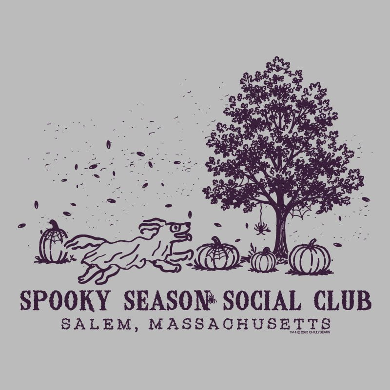 A peach-colored graphic print featuring a dark purple illustration of a running dog, pumpkins, a tree, and falling leaves, with the text 'SPOOKY SEASON SOCIAL CLUB' and 'SALEM, MASSACHUSETTS' below.